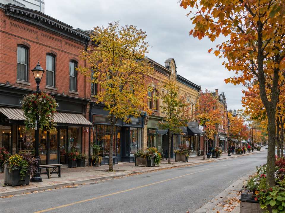 The historic main street of Streetsville with 19th-century brick storefronts and autumn trees
